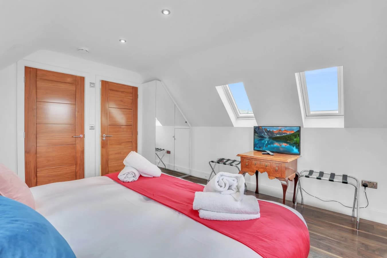 Comfortable bedroom with Smart TV and stylish décor