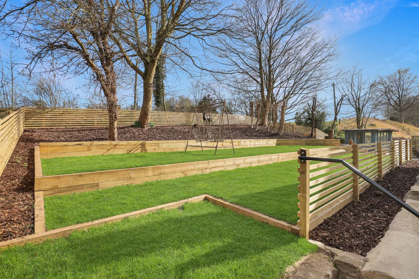 Enclosed lawn and garden with countryside setting beside the house