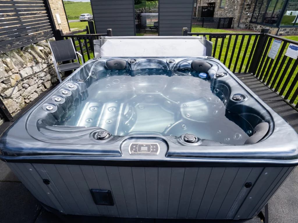 Shared outdoor hot tub with seating for guests