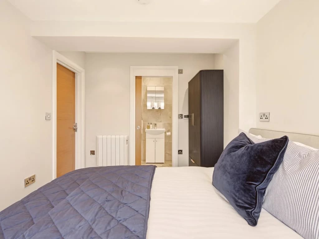 Comfortable double bedroom complete with private en-suite and modern furnishings