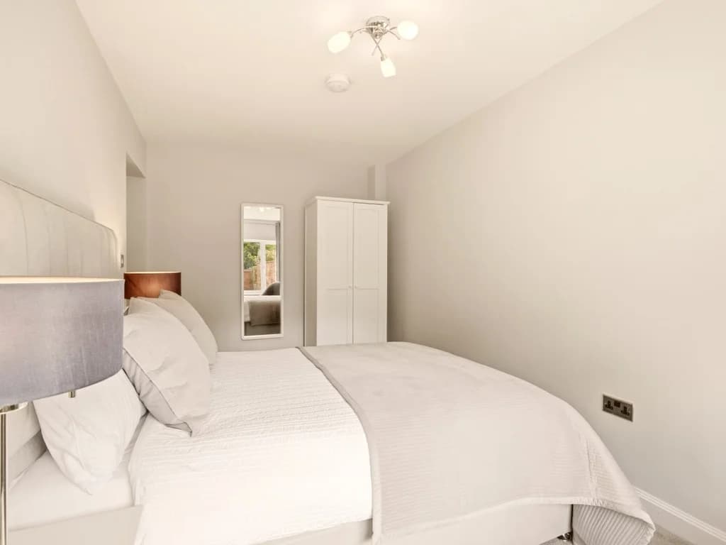 Bright and inviting double bedroom with stylish décor for a restful night's sleep