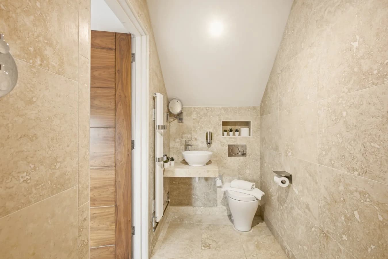 Ensuite bathroom with walk-in shower and stone-effect walls