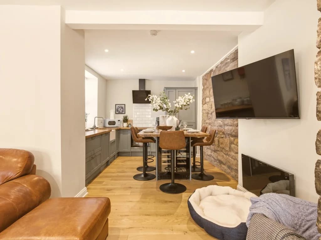 View from the lounge into the kitchen with breakfast bar seating.