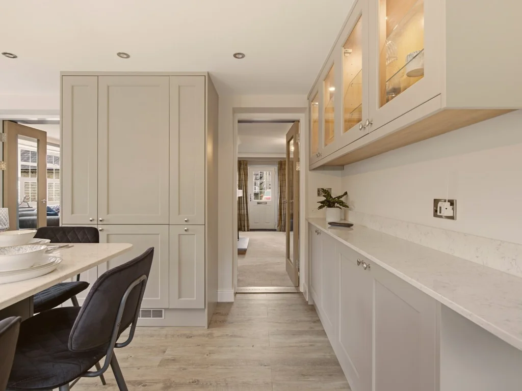 Elegant dining area with bespoke cabinetry and generous quartz worktops
