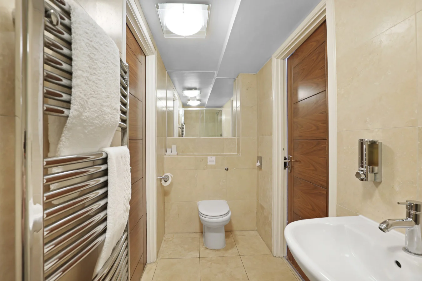 Bathroom with walk-in shower, heated towel rail and WC