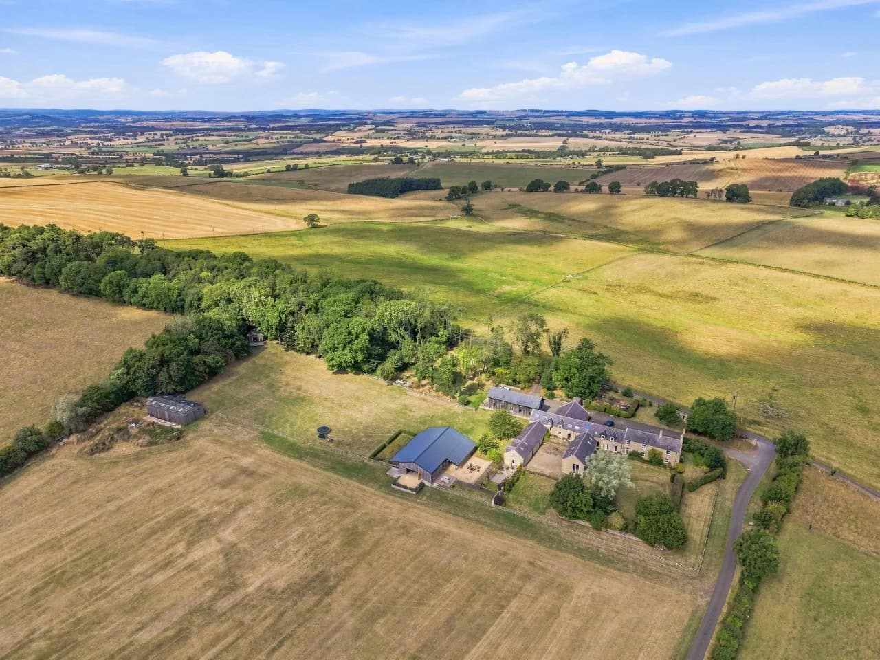 Aerial view of Roses Bower surrounded by open countryside