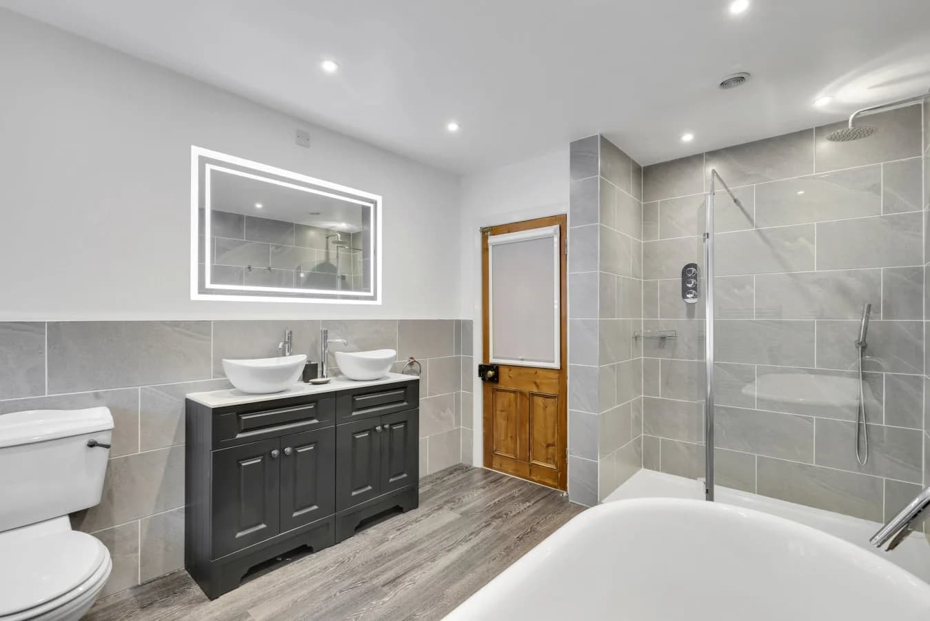 Family bathroom with freestanding tub and oversized walk-in shower