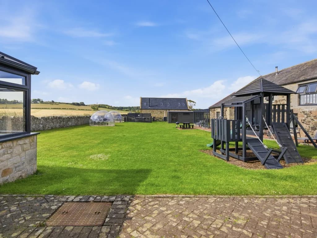 Shared paddock with open lawn and countryside surroundings