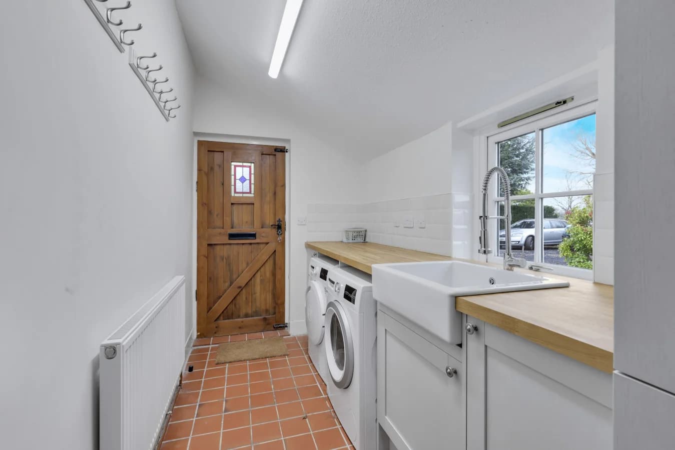 Practical utility room with laundry facilities and garden access