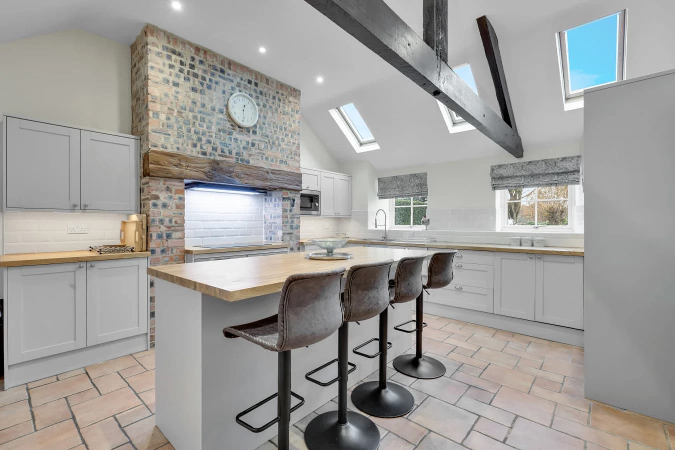Light-filled kitchen with skylights and breakfast seating for four