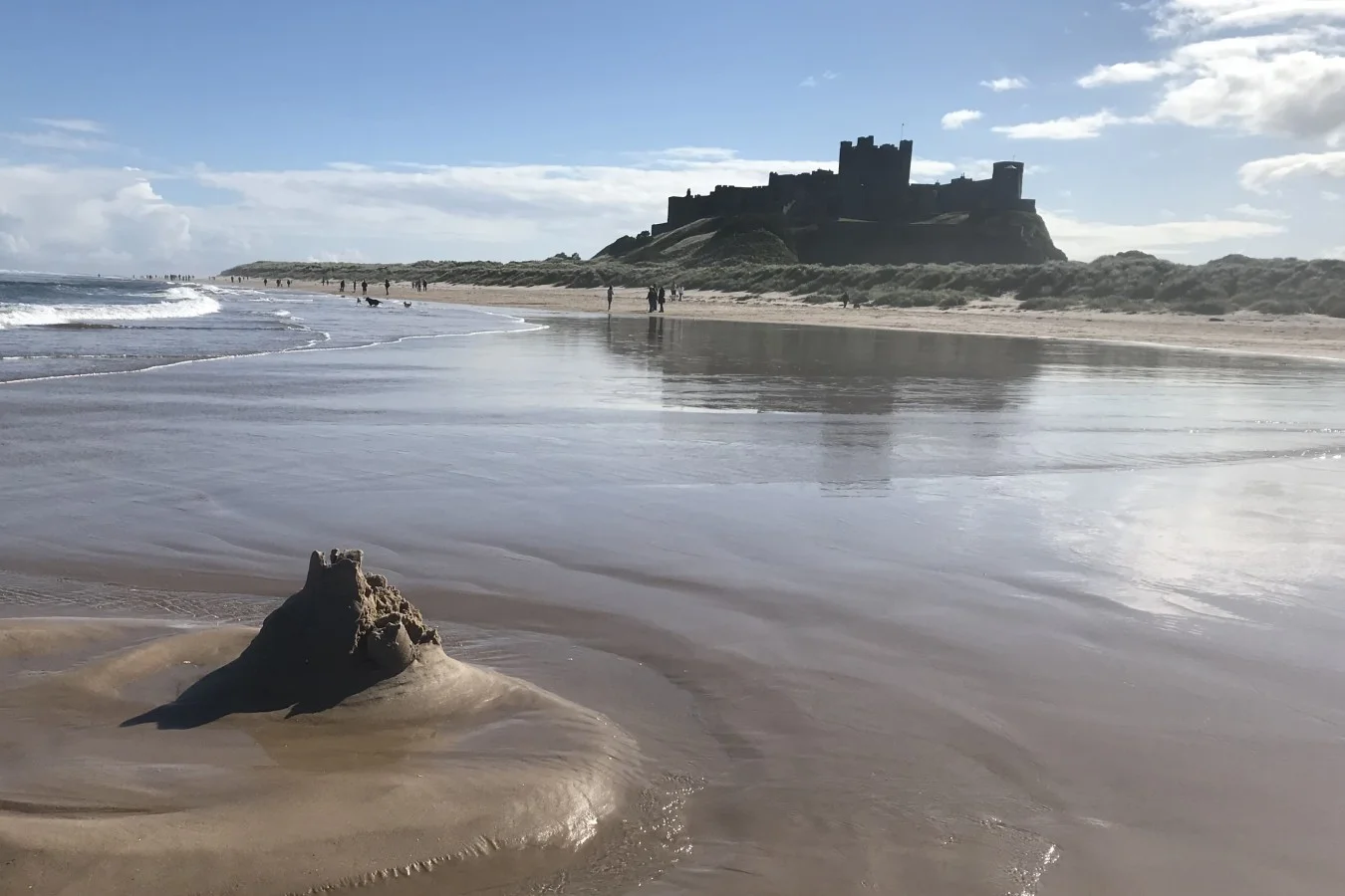 Iconic Bamburgh Castle overlooks miles of golden beach and stunning coastal scenery