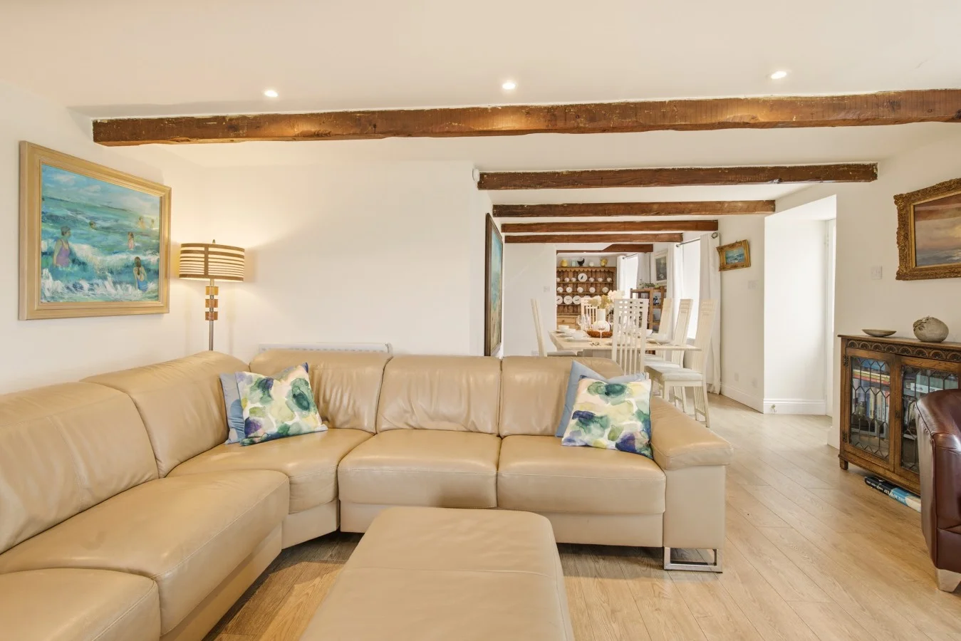 Open-plan living and dining area with corner sofa