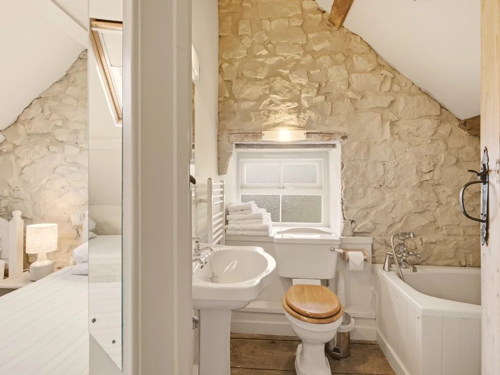 Ensuite bathroom with bath and shower attachment