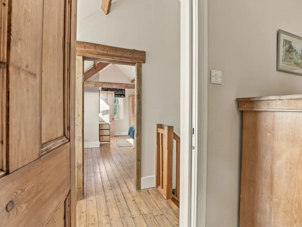 Upper-floor landing with original wooden doors and timber details