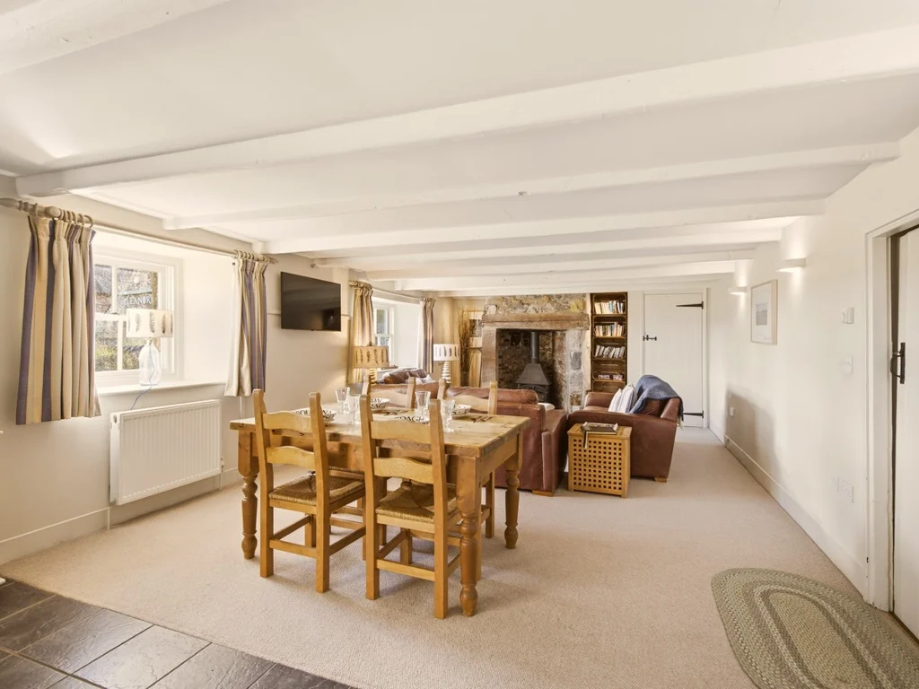 Dining table and comfortable lounge in the open-plan ground floor