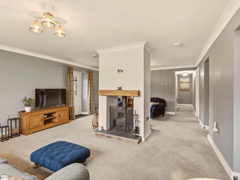 Comfortable living room with feature fireplace and Smart TV for cosy evenings