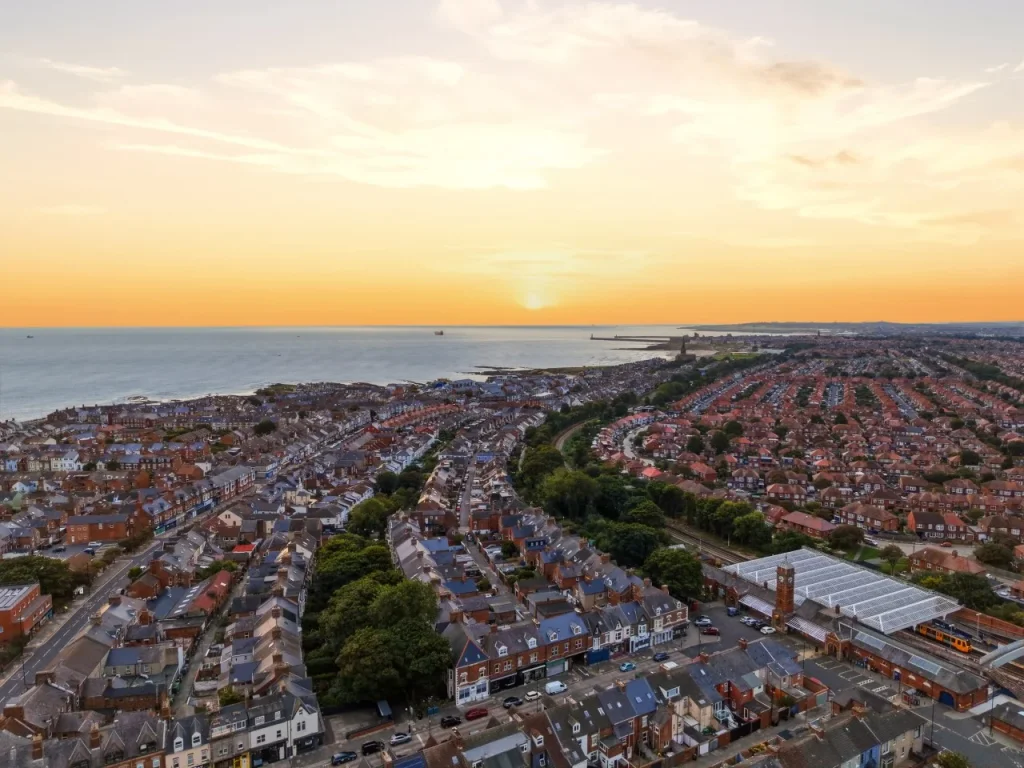 Aerial sunset view across Whitley Bay with the coastline stretching beyond