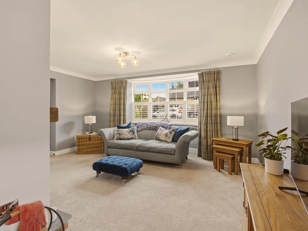 Bright lounge with soft neutral décor and comfortable seating for everyone