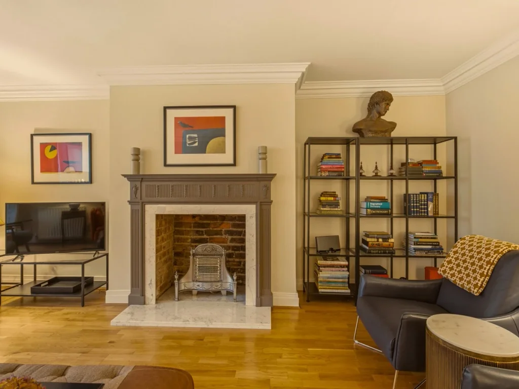 Elegant sitting area with a fireplace and comfortable armchairs