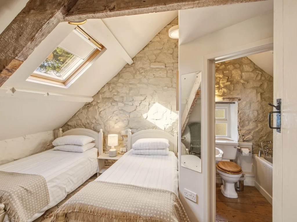 Twin bedroom with built-in storage and exposed ceiling beams