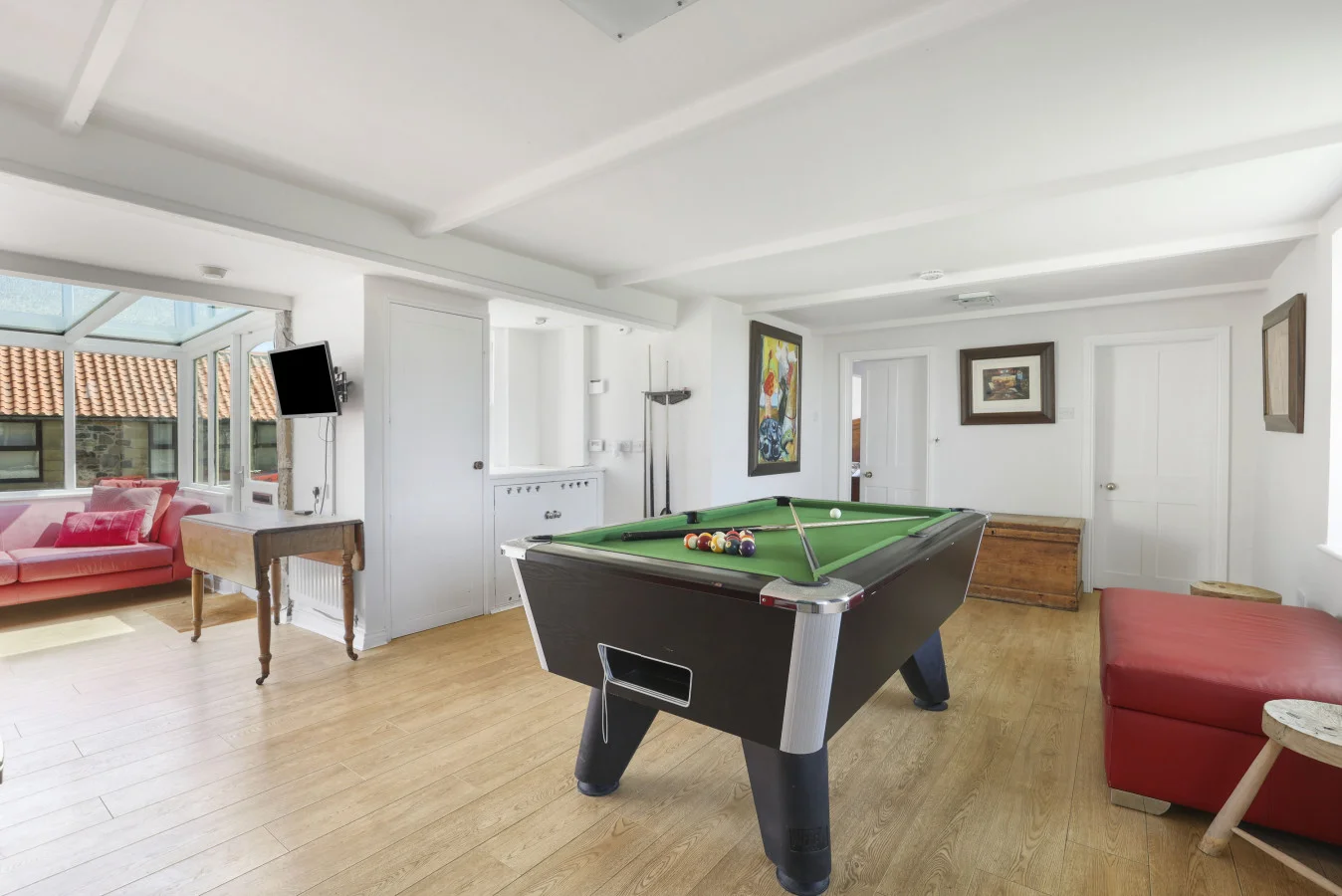 Games room with pool table, TV and oak flooring