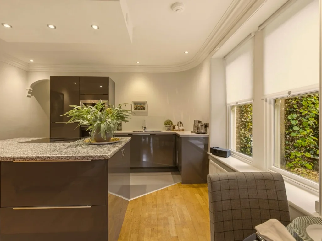 Bright kitchen with dark cabinets and a spacious worktop