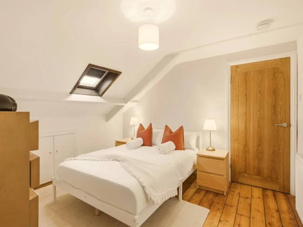 Double bedroom with bedside tables, skylight and useful drawer storage