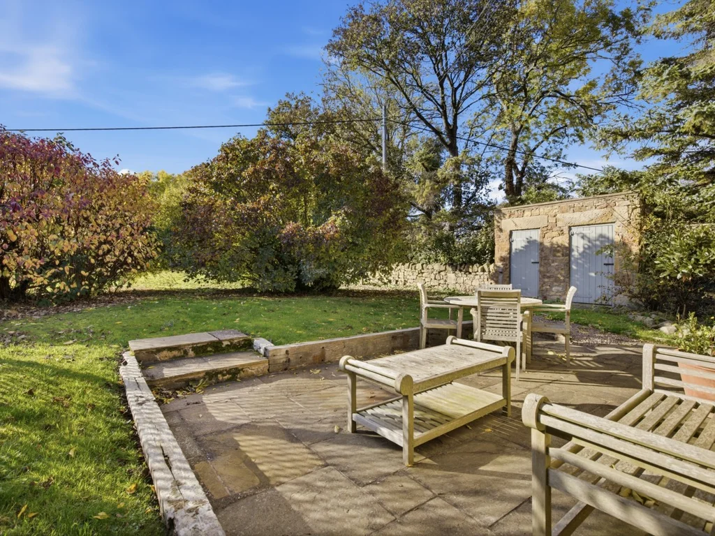 Relax outdoors in the garden with a paved seating area