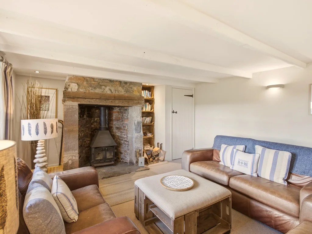 Traditional inglenook fireplace and inviting seating at Spitalford