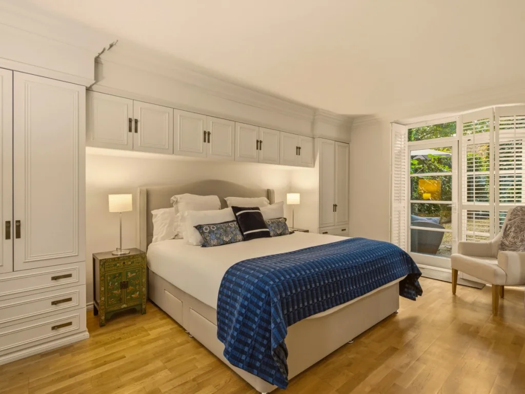 Super king bedroom with bedding and built-in storage