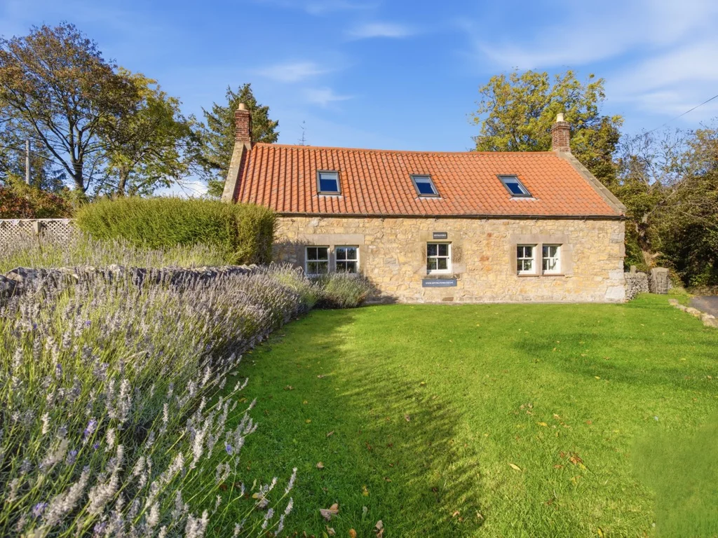 Spitalford's stone cottage surrounded by a spacious garden