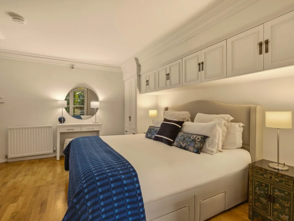 Super king bedroom with bedding and fitted wardrobes
