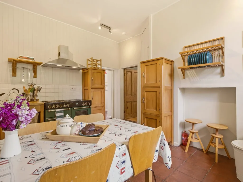 Traditional country kitchen with dining table and charming breakfast nook