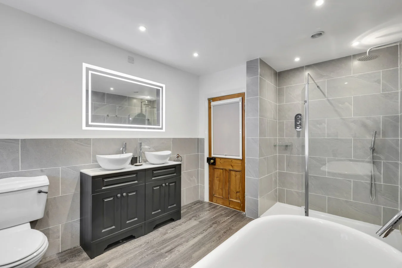 Family bathroom with freestanding tub and oversized walk-in shower