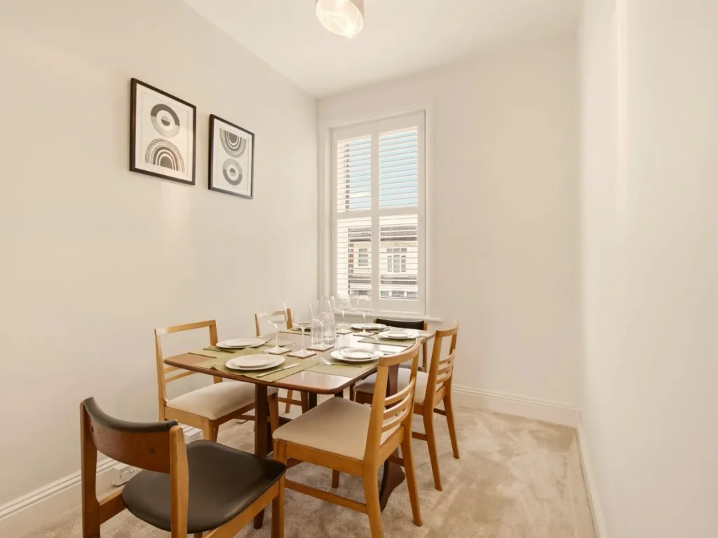 Separate dining area with table for six and plenty of natural light