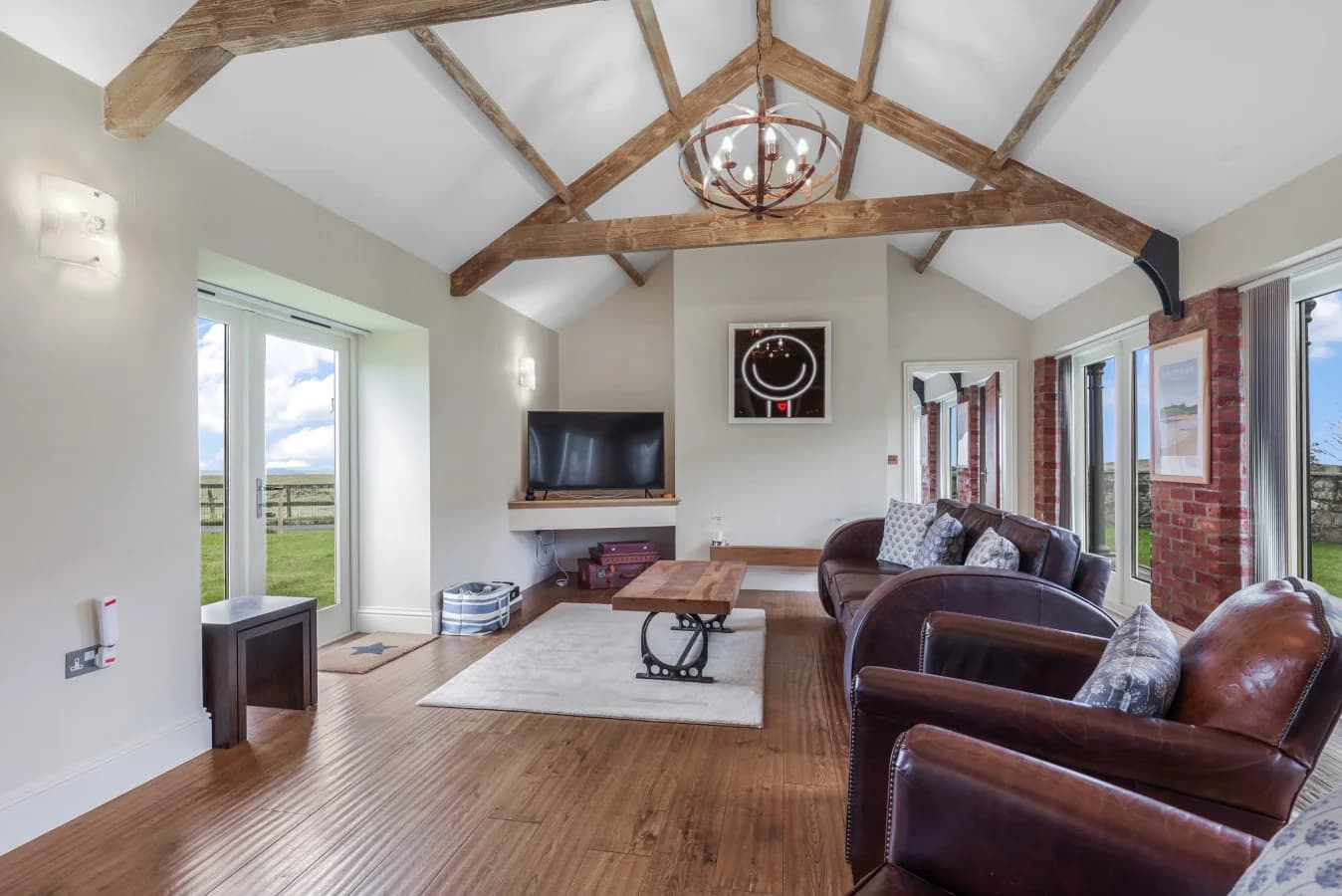 Bright lounge with comfortable seating, Smart TV and sea views