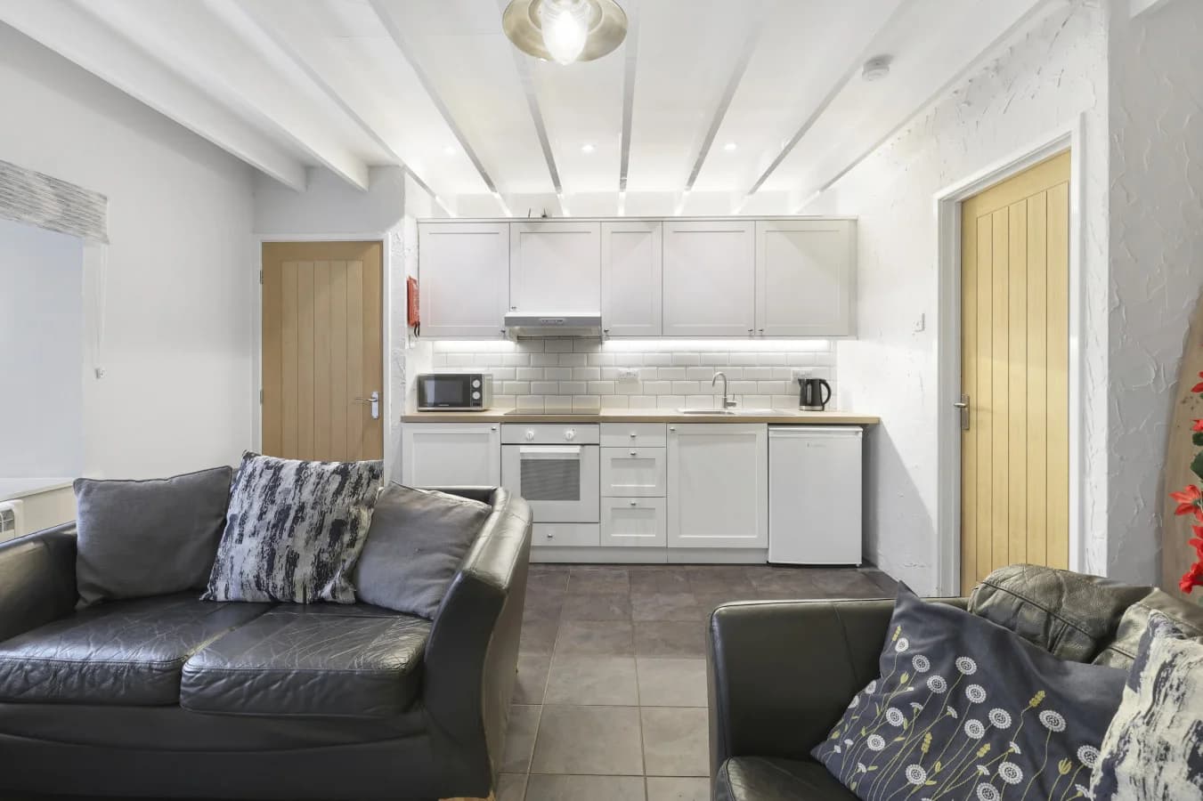 Bright studio-style layout with fitted kitchen and comfortable lounge