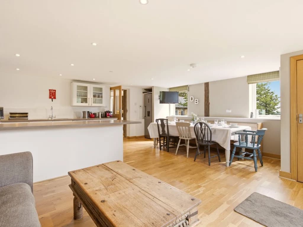 Open-plan kitchen and dining area with generous seating for guests