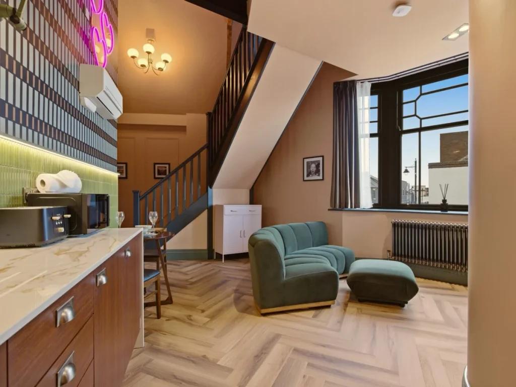 Stylish kitchenette and seating area beneath the mezzanine level