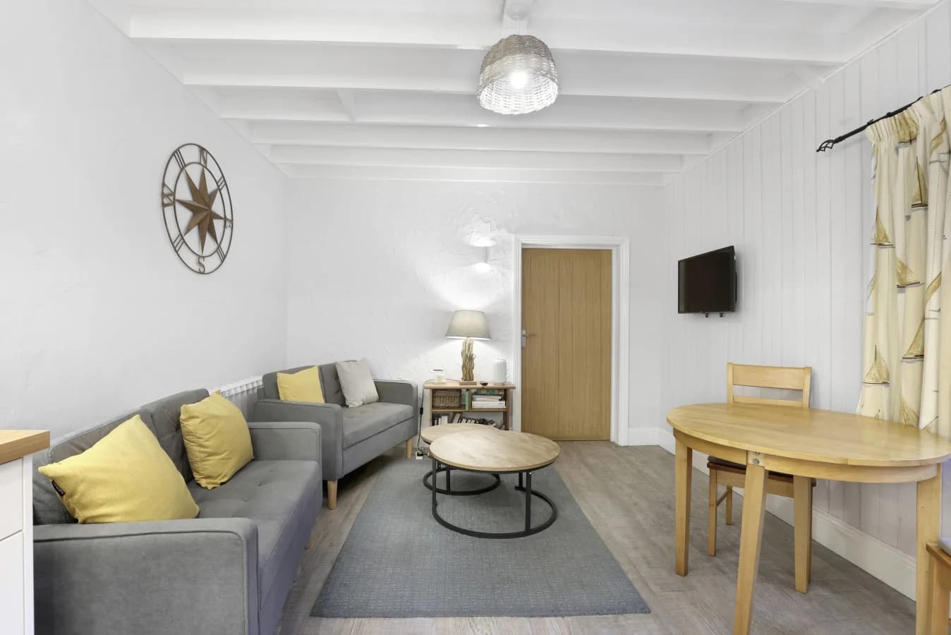 Bright lounge and dining area with nautical-inspired décor