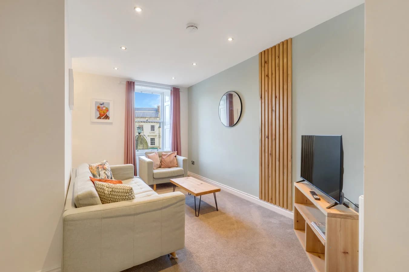 Contemporary lounge with soft sage tones, oak accents and open-plan living