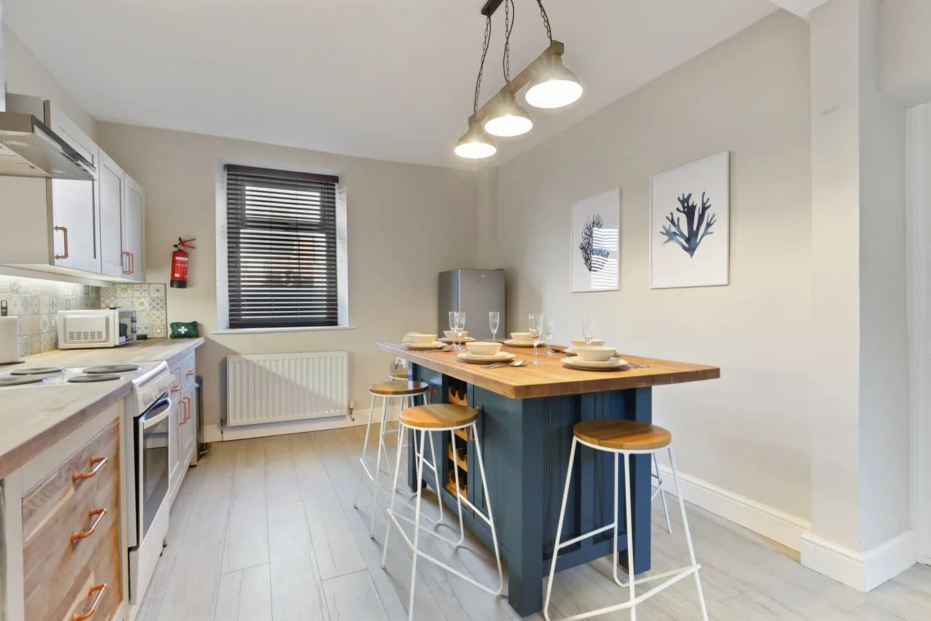 Contemporary kitchen diner with breakfast bar seating for six