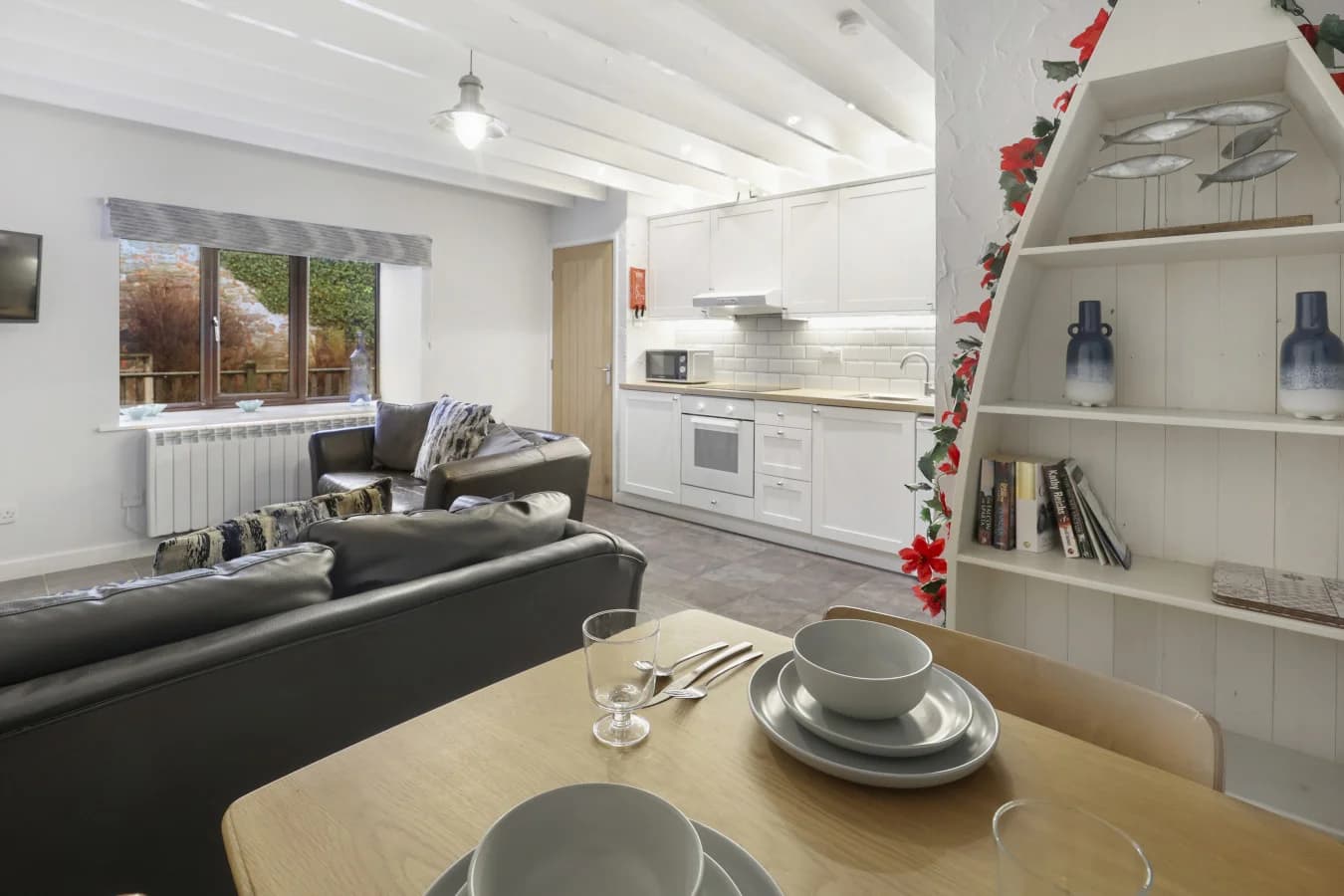 Dining area overlooking the lounge and fully equipped kitchen