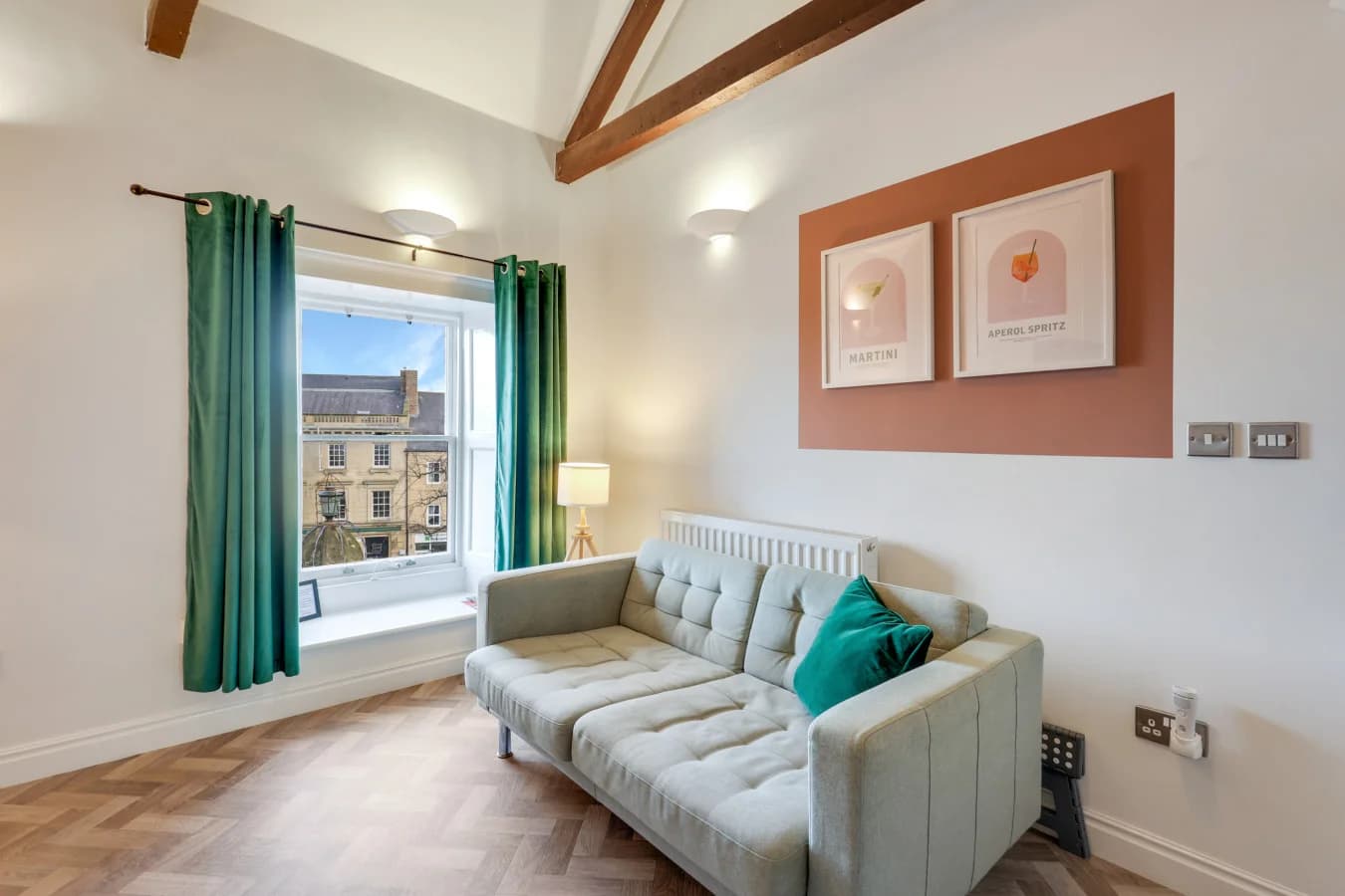 Large window framing views across historic Alnwick town centre
