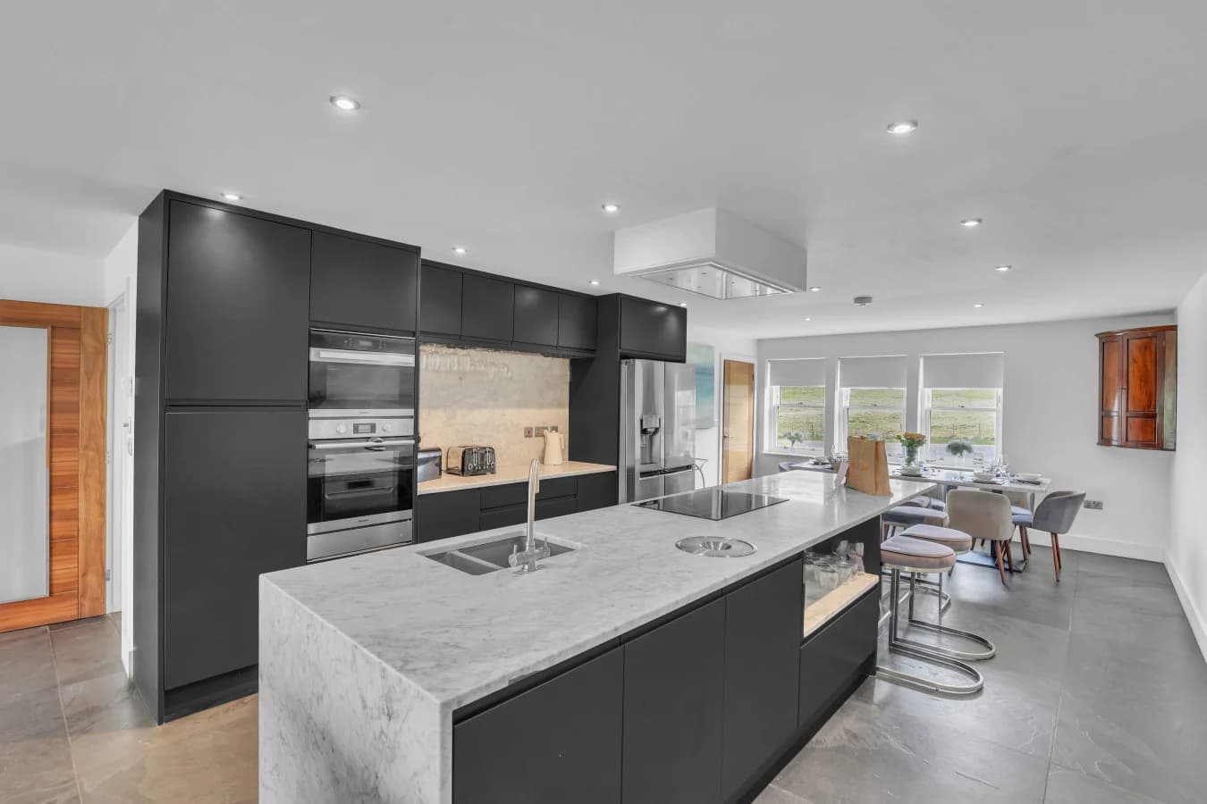 Luxury marble kitchen with island, double ovens and views
