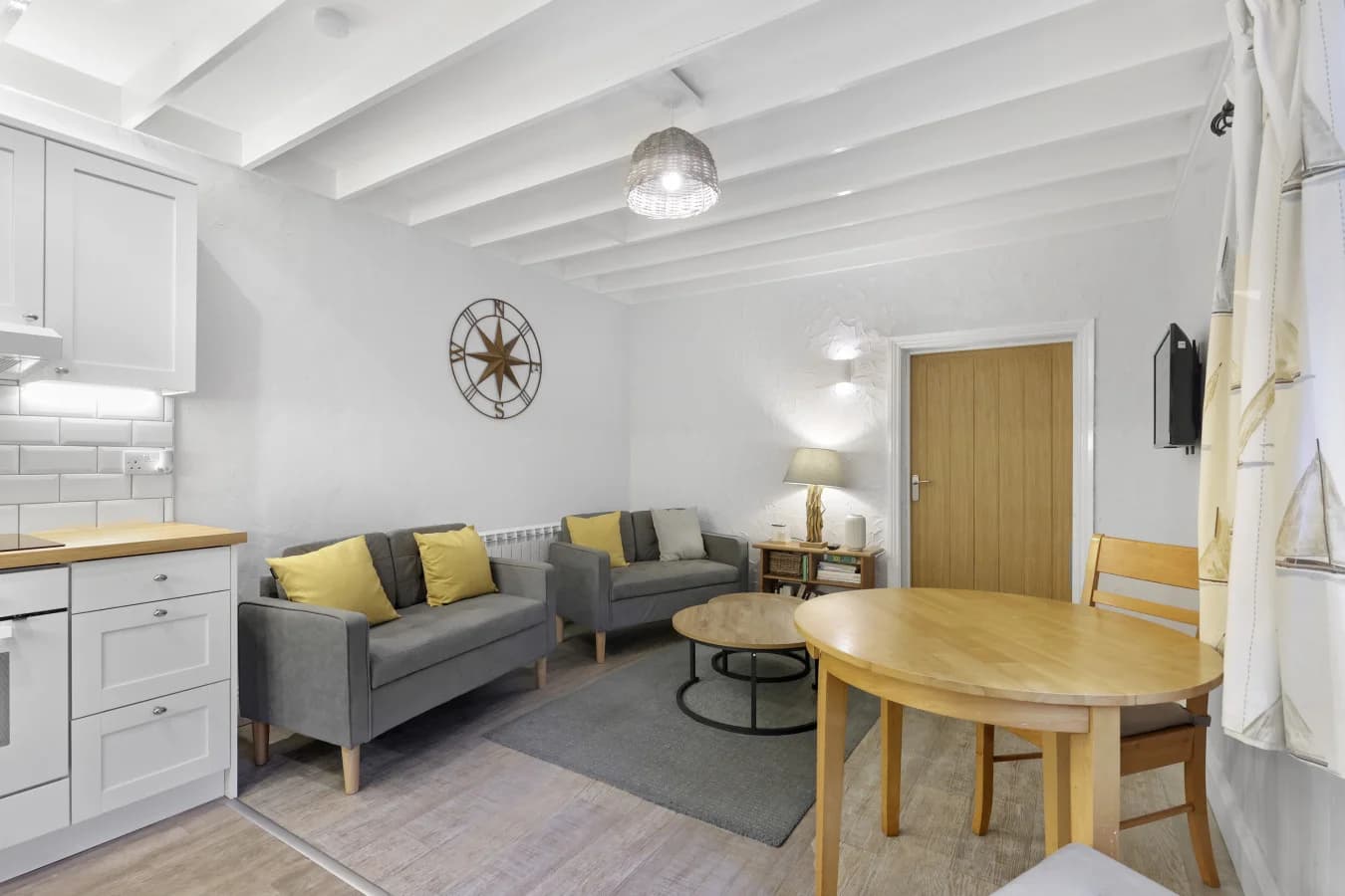 Open-plan living space with coastal colours and comfortable seating