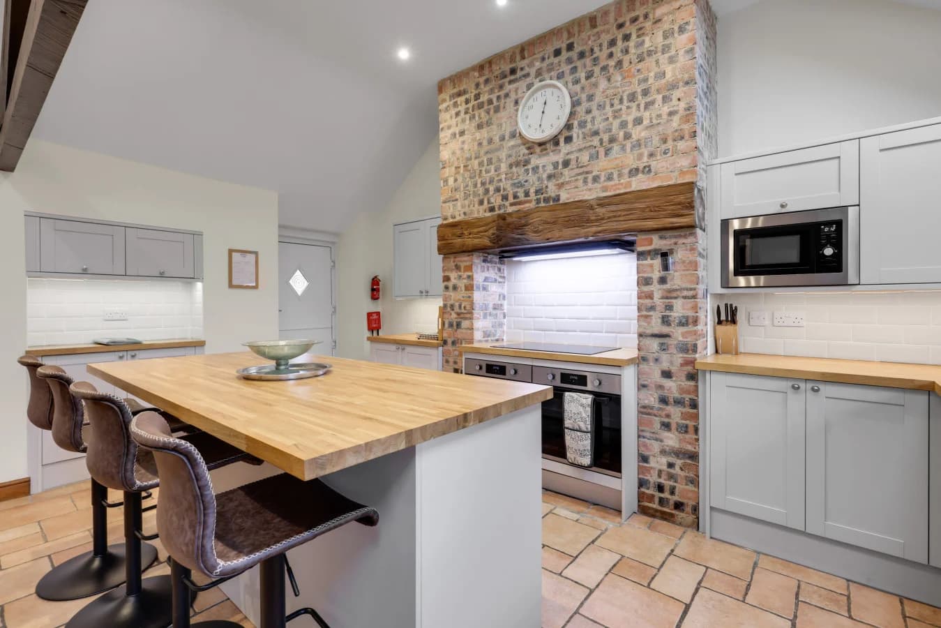 Characterful kitchen blending exposed brick with modern finishes
