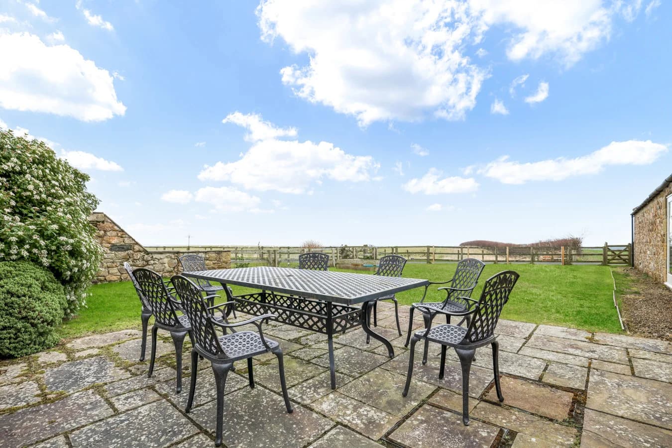 Private patio with outdoor dining and countryside views