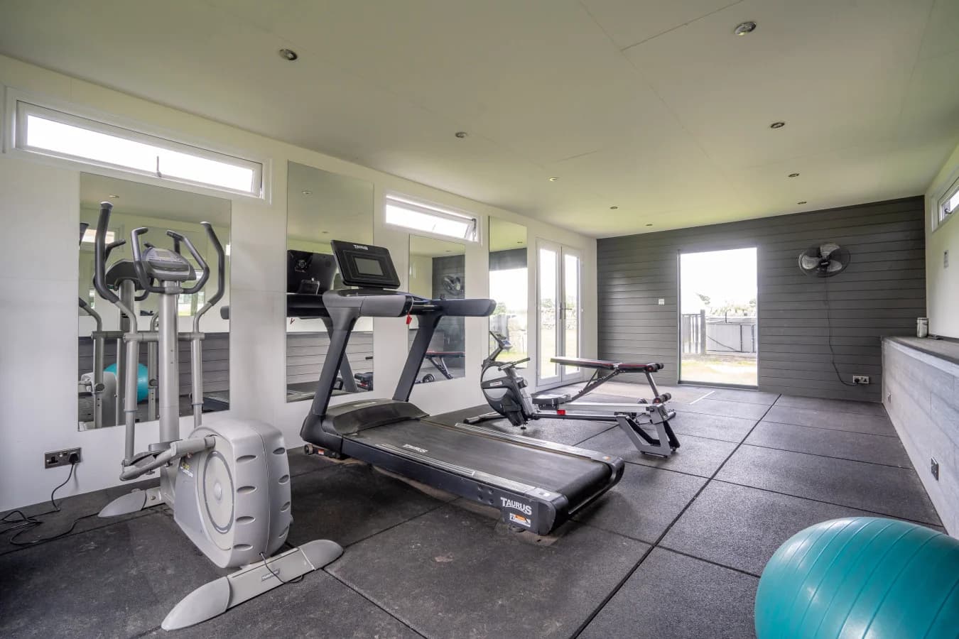 Shared gym with cardio and strength equipment